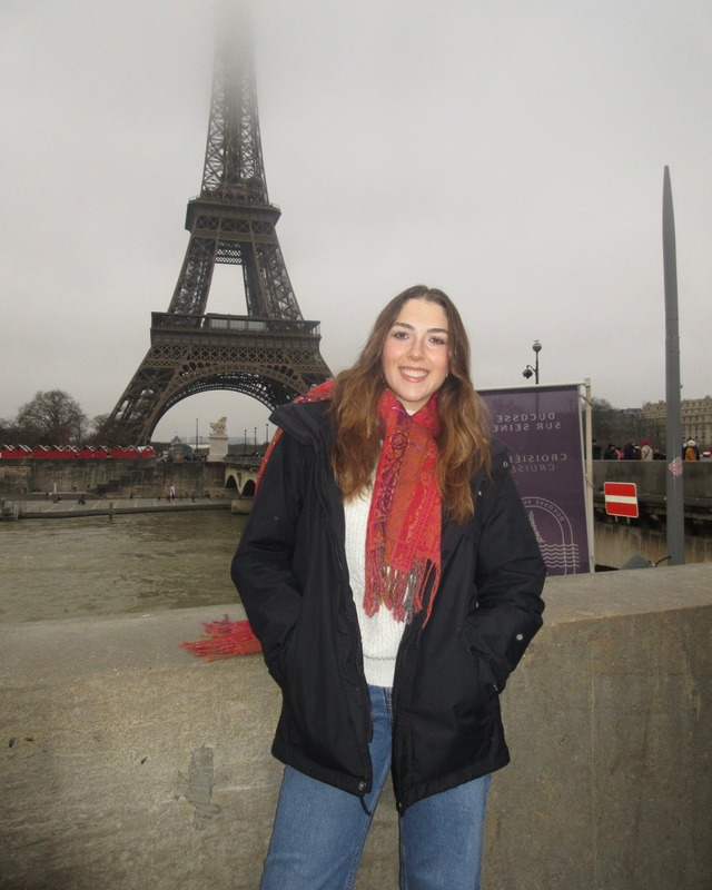 Maya in front of the Eiffel Tower